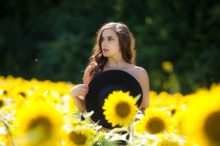 Outdoor boudoir session with sunflowers