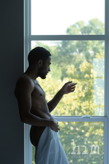 Nude male at the window