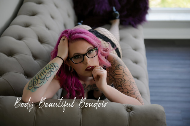 Woman with pink hair and tattoos