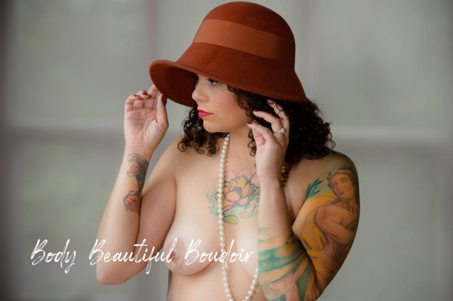 Woman in a Hat with pearls and tattoos