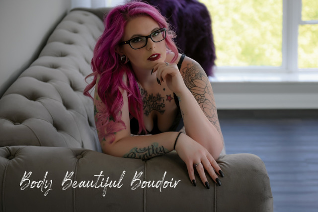 Pink haired woman in glasses